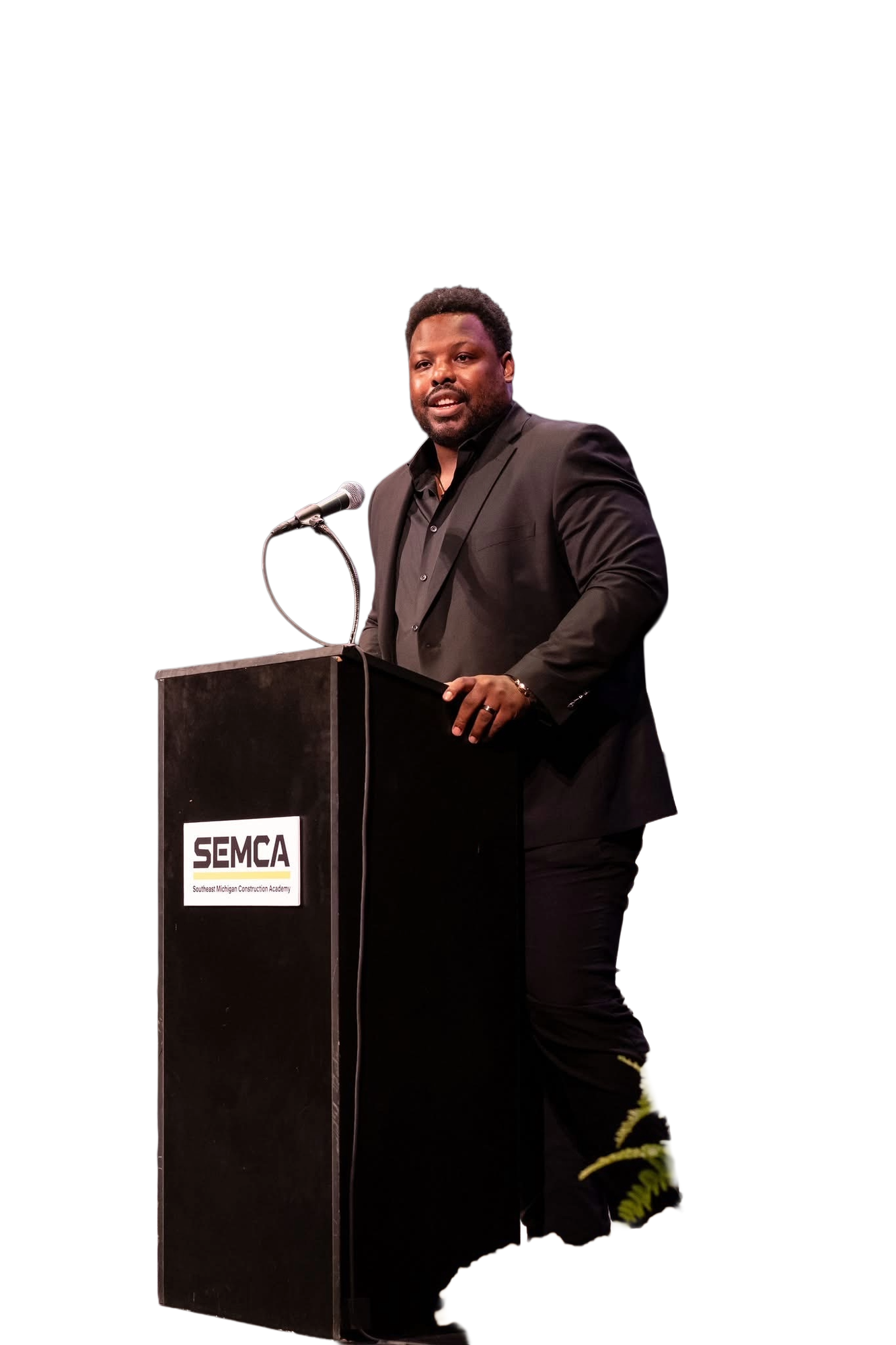 Jehuu Caulcrick delivering remarks from the podium