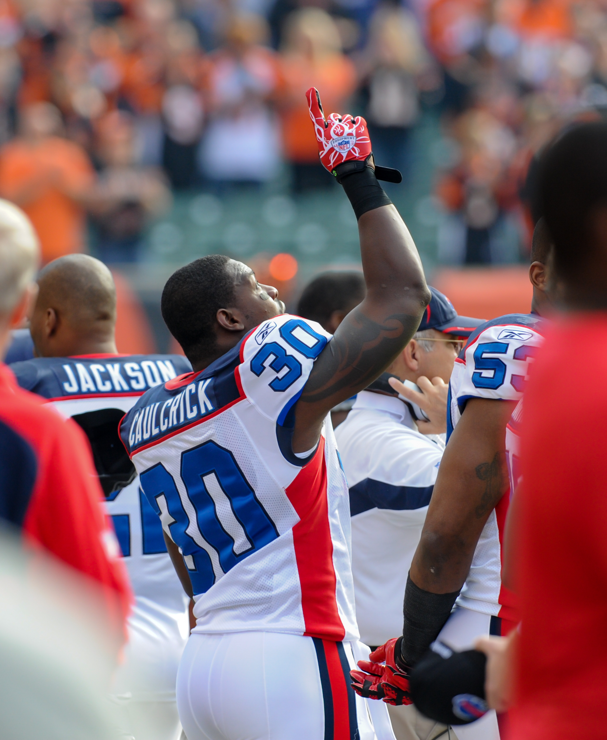 Jehuu Caulcrick #30 saluting the sky during the national anthem